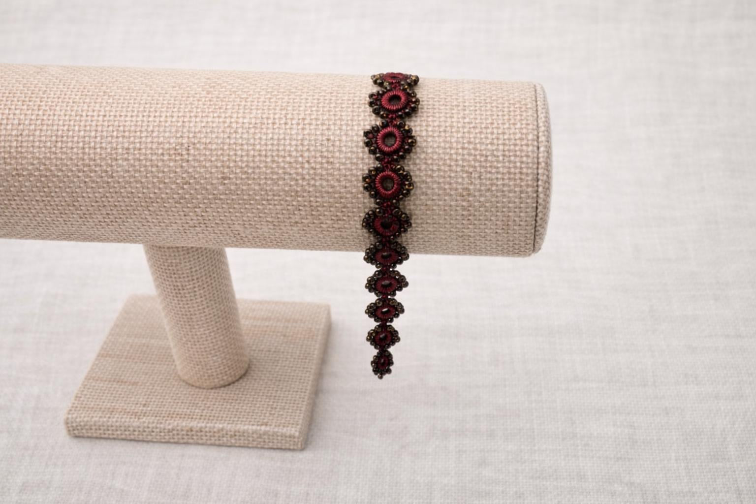 Delicate handmade crochet bracelet with beads and intricate circles. Burgundy.