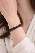 Delicate handmade crochet bracelet with beads and intricate circles. Burgundy.