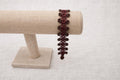 Delicate handmade crochet bracelet with beads and intricate weave. Burgundy.