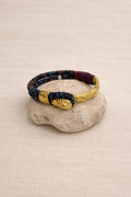 Gold-plated and fabric bracelet. Vintage handcrafted with colorful threads.