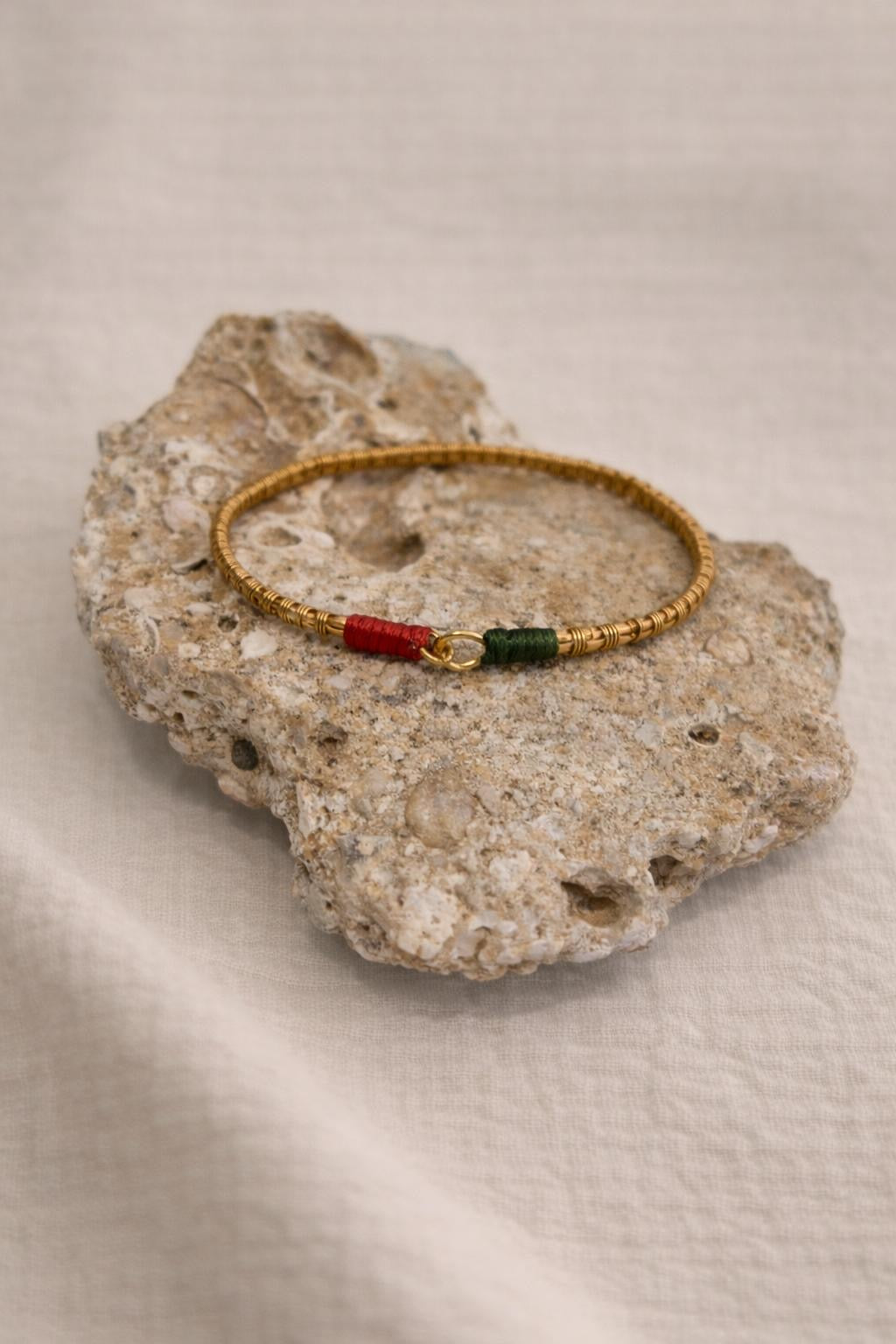 Handcrafted gold-plated bracelet. A timeless piece designed for everyday luxury and beauty. Green & red accents.