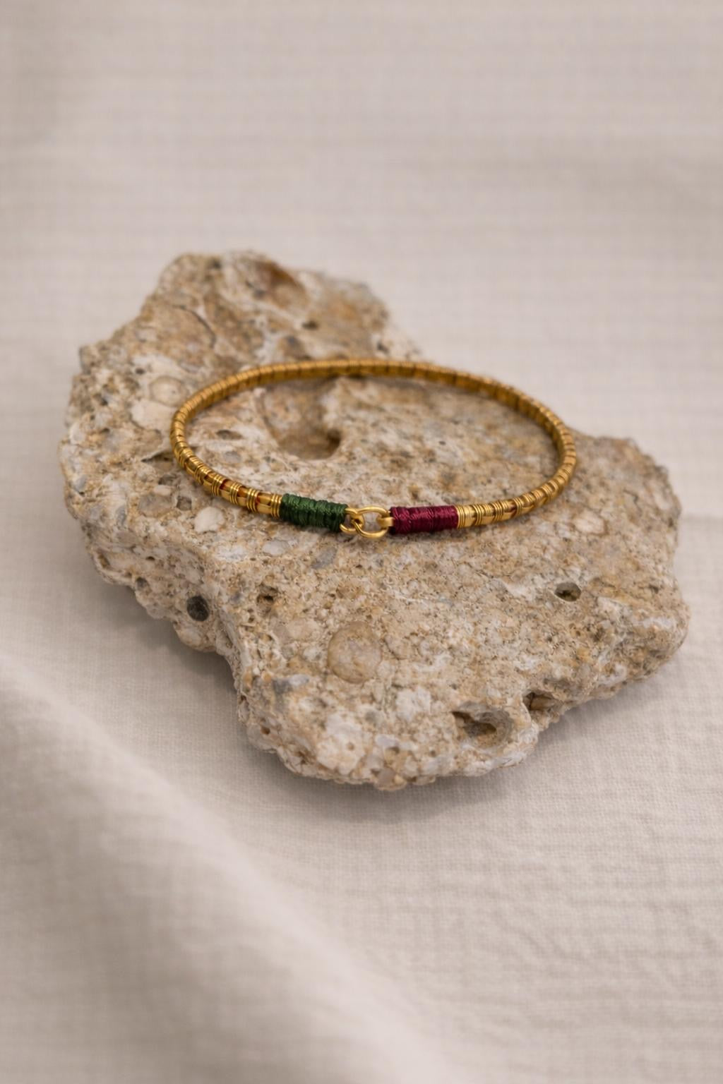 Handcrafted gold-plated bracelet. A timeless piece designed for everyday luxury and beauty. Green & magenta accents.
