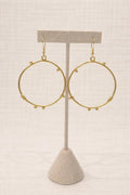 Hoop earrings finished in warm gold plating.
