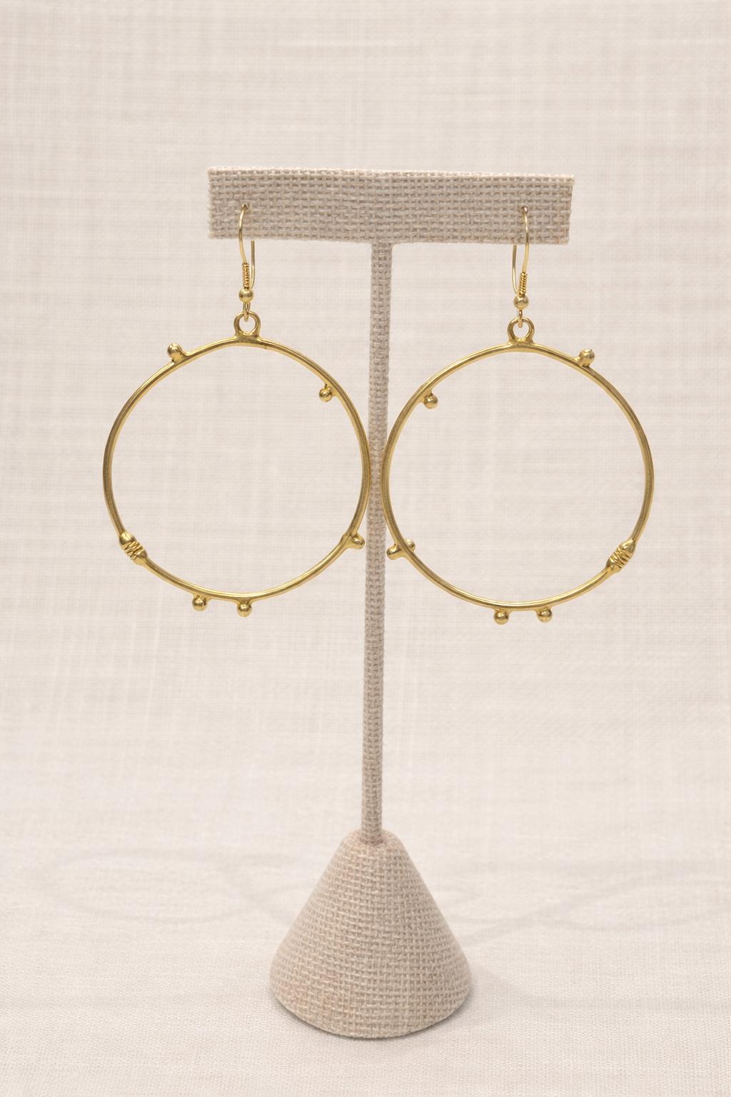 Hoop earrings finished in warm gold plating.