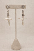 Earrings crafted with genuine mother of pearl, finished with polished sterling silver.
