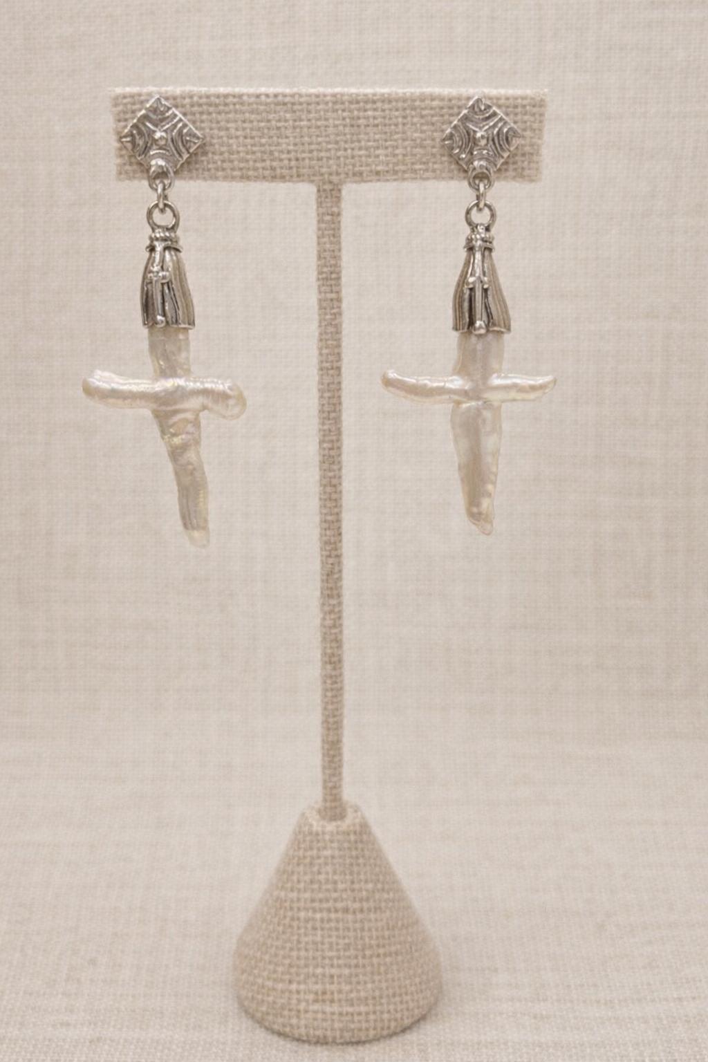 Earrings crafted with genuine mother of pearl, finished with polished sterling silver.