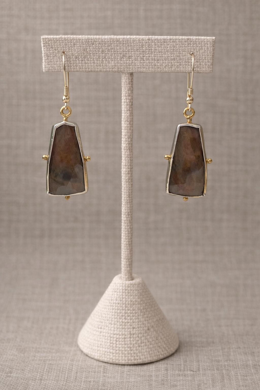 Earrings featuring faceted brown gemstones set in sterling silver.