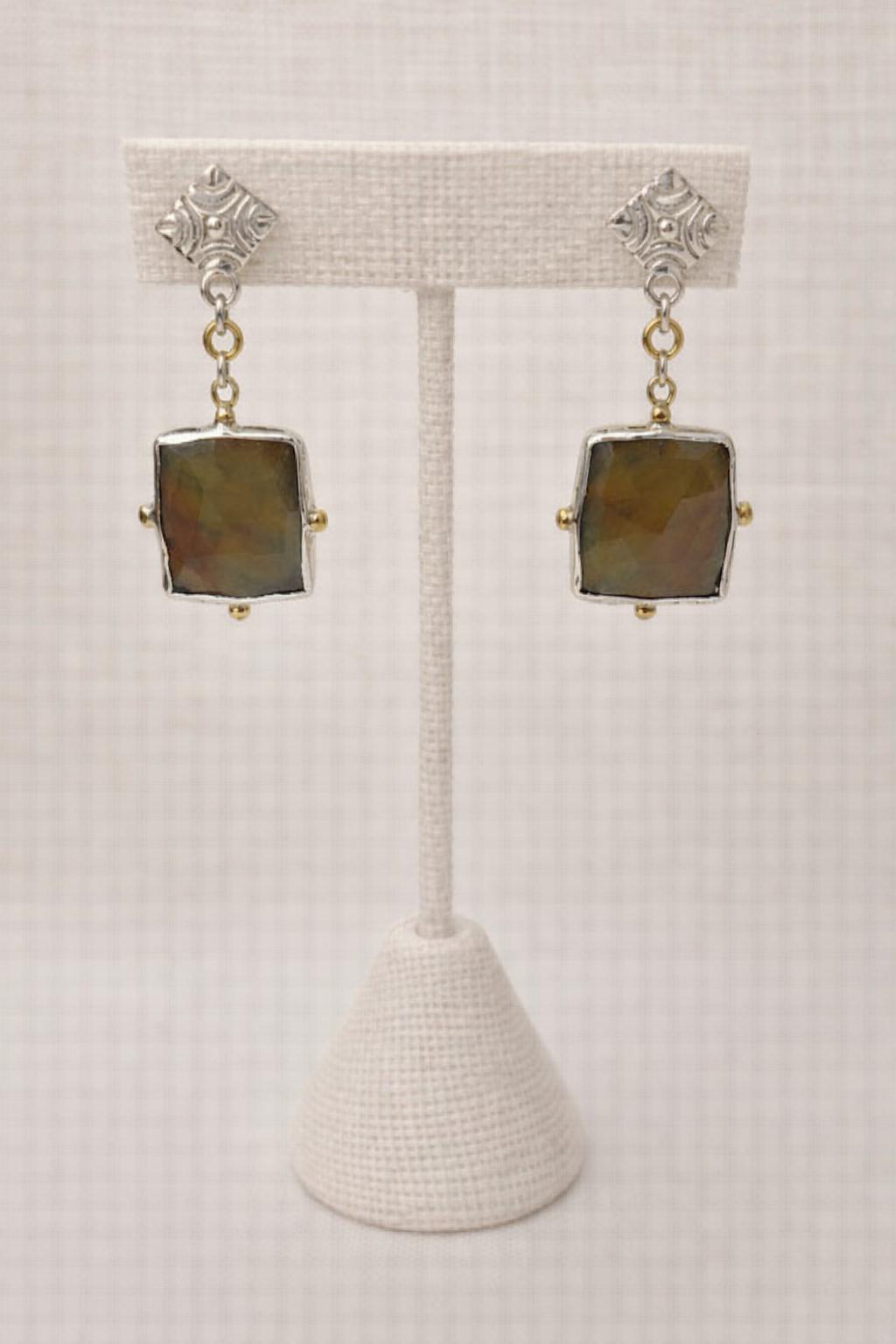 Earrings featuring softly faceted square gemstones set in sterling silver.