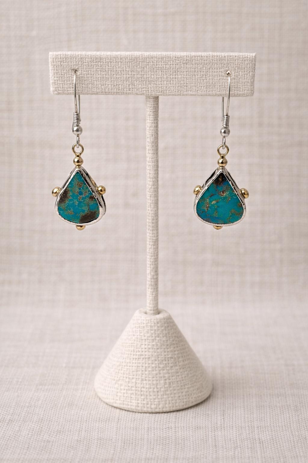 Earrings handcrafted with genuine turquoise and sterling silver.