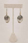 Oval earrings handcrafted in sterling silver with three dangles.