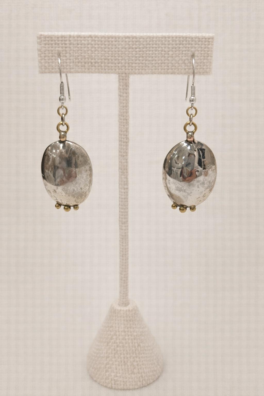 Oval earrings handcrafted in sterling silver with three dangles.