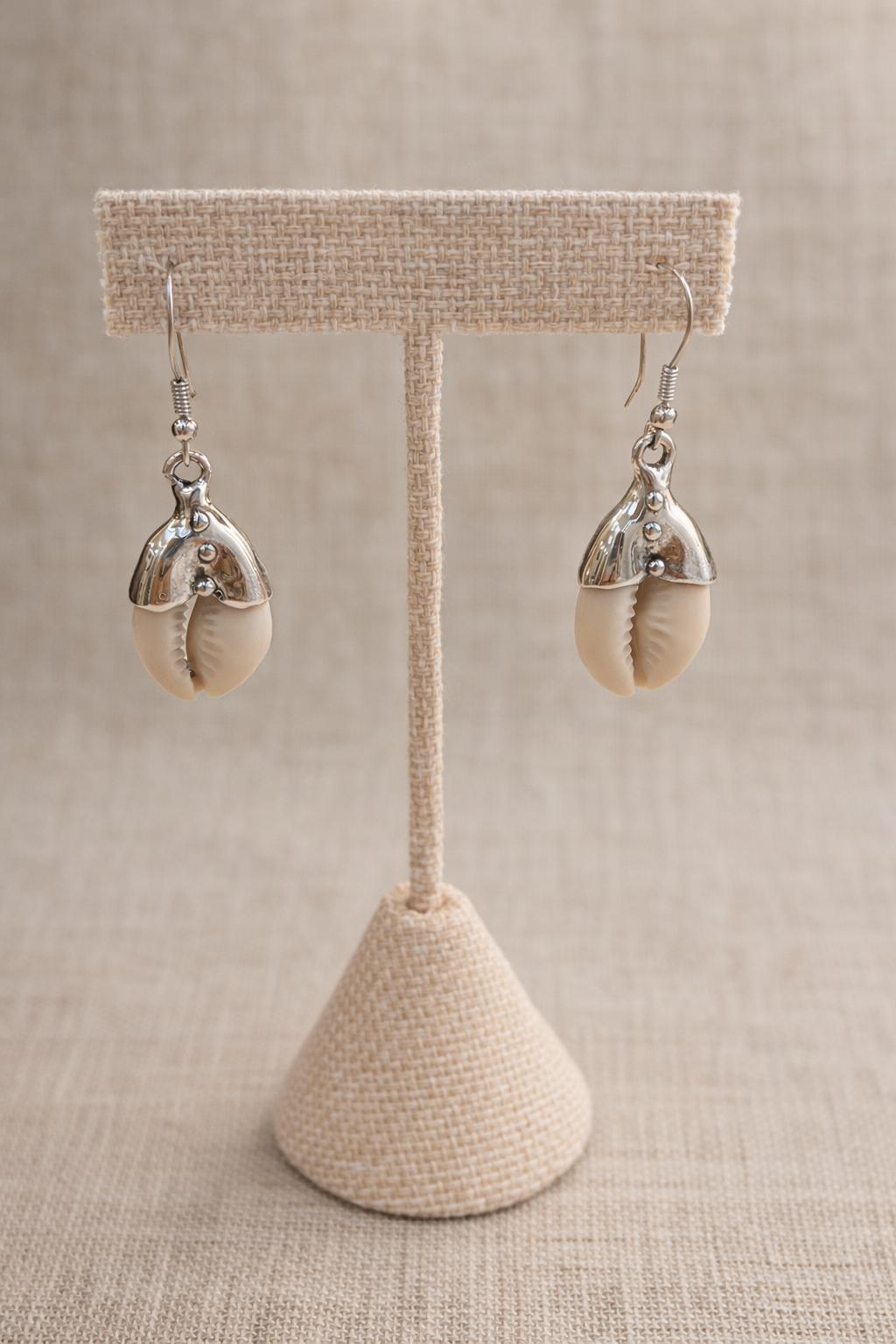 Earrings crafted in sterling silver and accented with natural seashells.