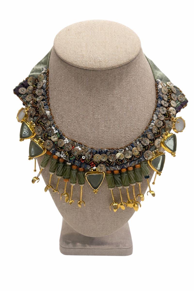 Handcrafted necklace featuring coral, mother of pearl and gold-plated accents.