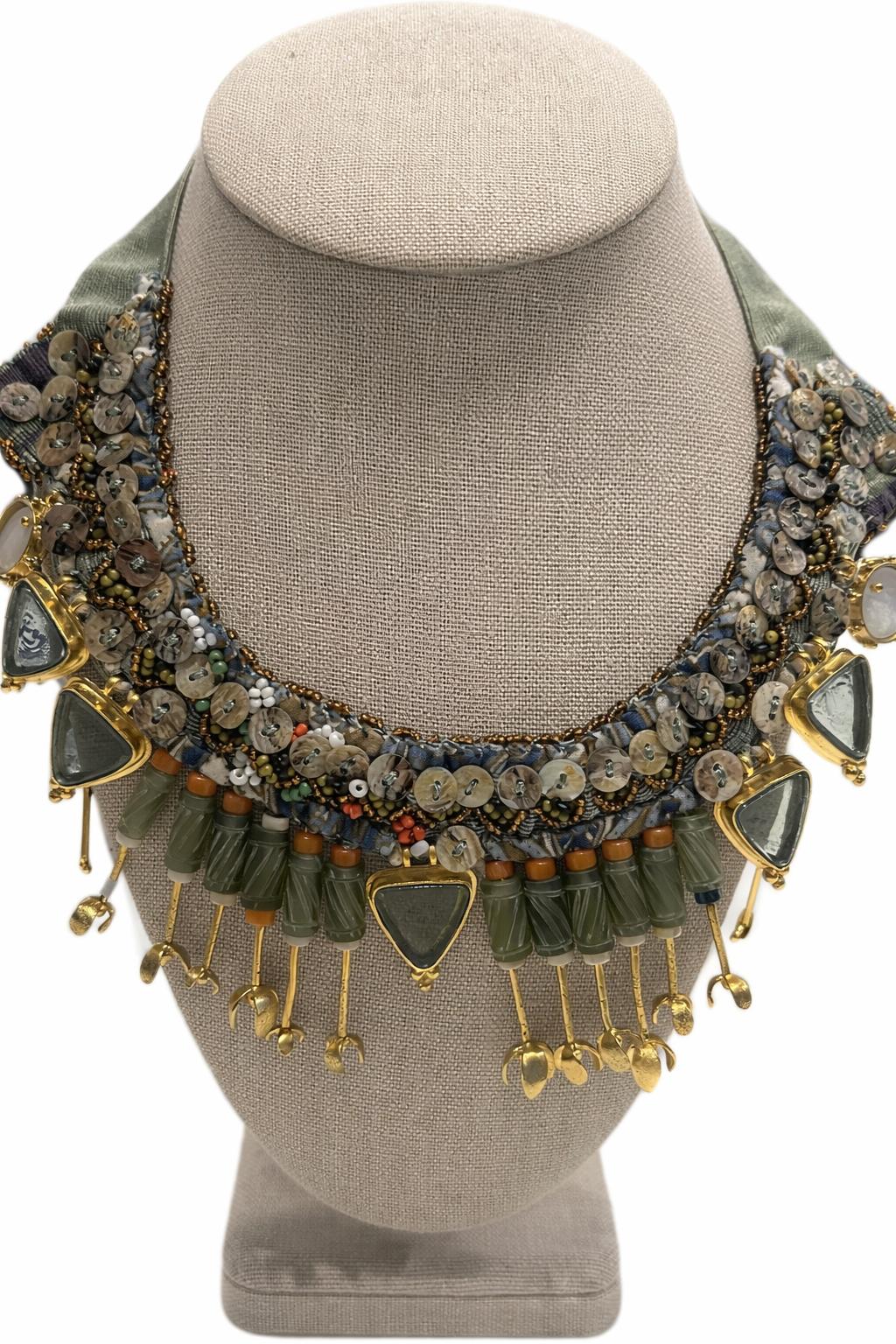 Handcrafted necklace featuring coral, mother of pearl and gold-plated accents.